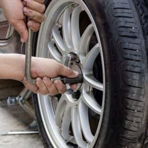 removing car lug nuts from a tire