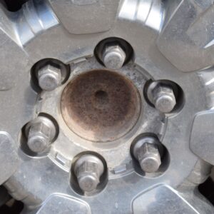 close up shot of wheel lug nuts