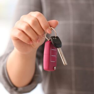 woman holding car keys