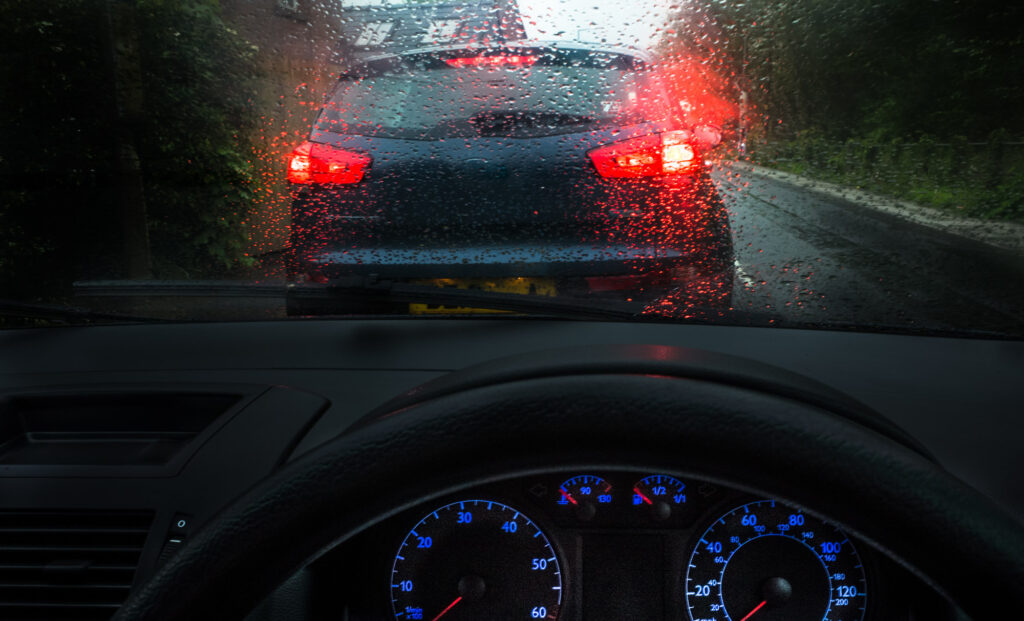 tailgating a car on a rainy day