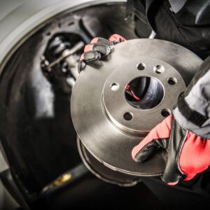 mechanic holding a brake disc