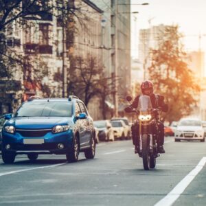 car and motorcycle on the road