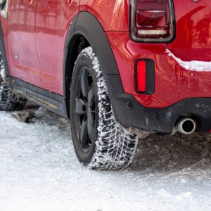 red car on a snowy road