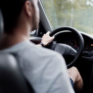 man driving a car