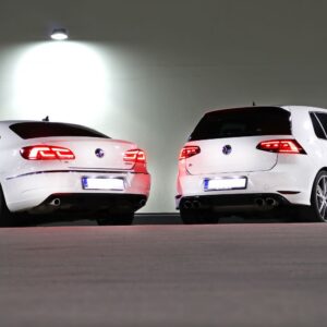 rears of white sedan and hatchback