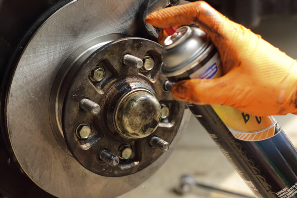 applying car brake cleaner