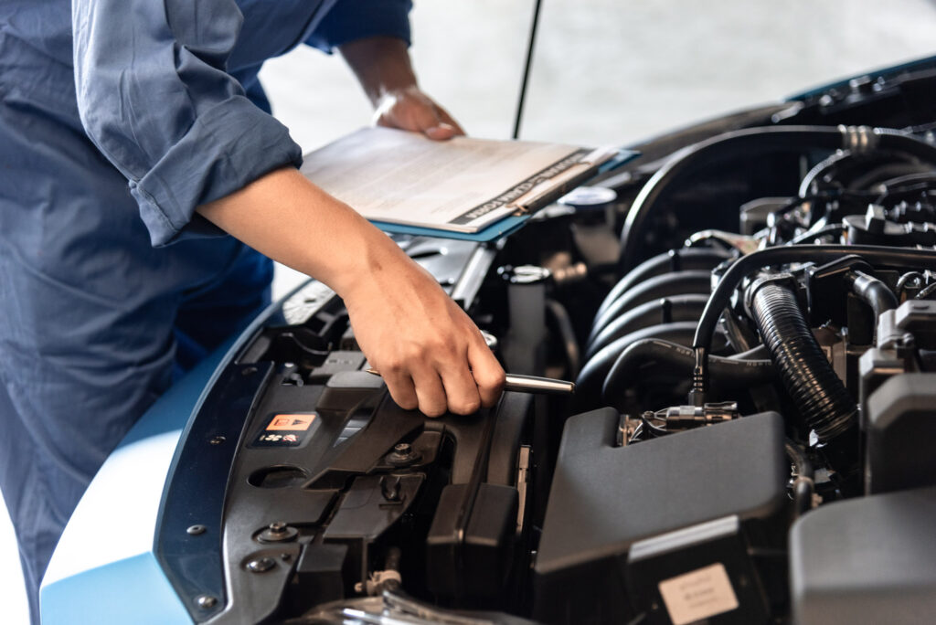 checking car engine and parts under the hood