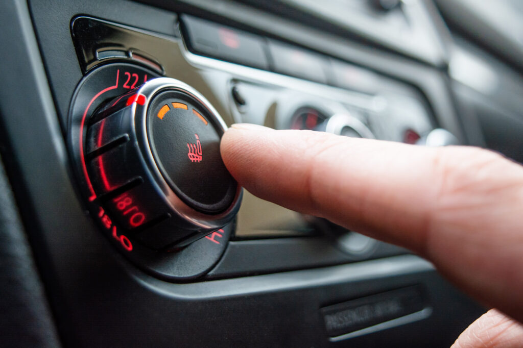 button for heating the car seats pressed close up