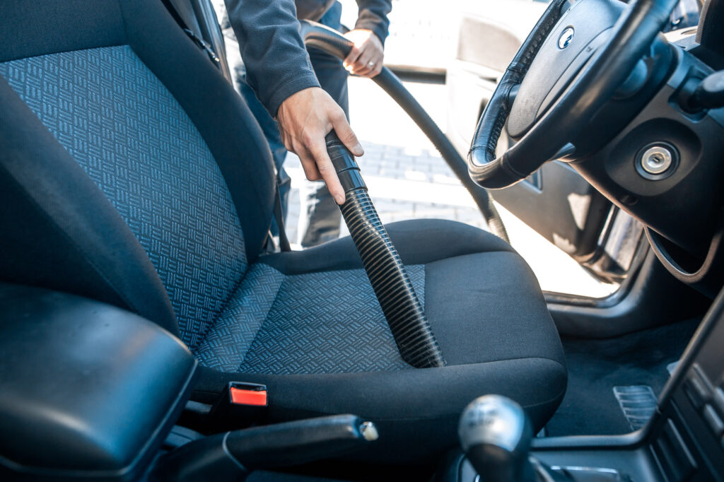 car interior cleaning with small vacuum