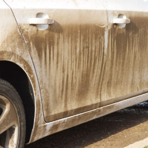 car side with dried mud