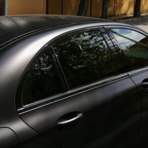 side shot of a matte black car