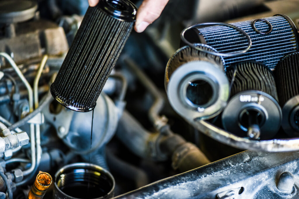 old engine oil filter removed for replacement