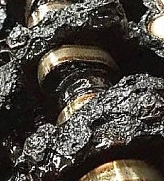 gunk and debris buildup inside an engine