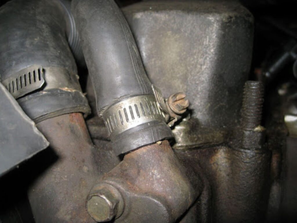 image of a car heater hose with worm type clamp