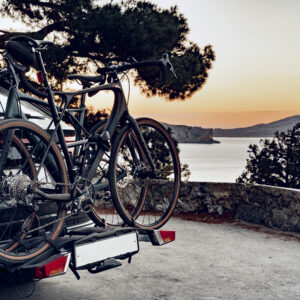 bikes mounted at the back of a sedan