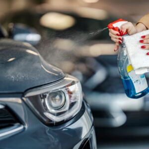 spraying a cleaning solution to a tire