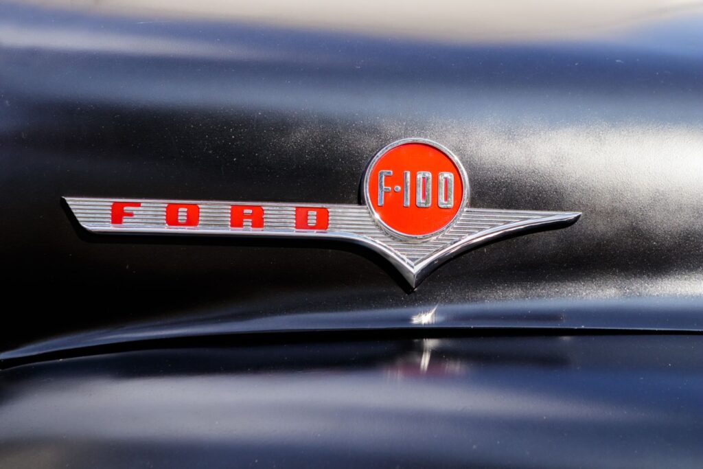 close up shot of a ford f100 logo