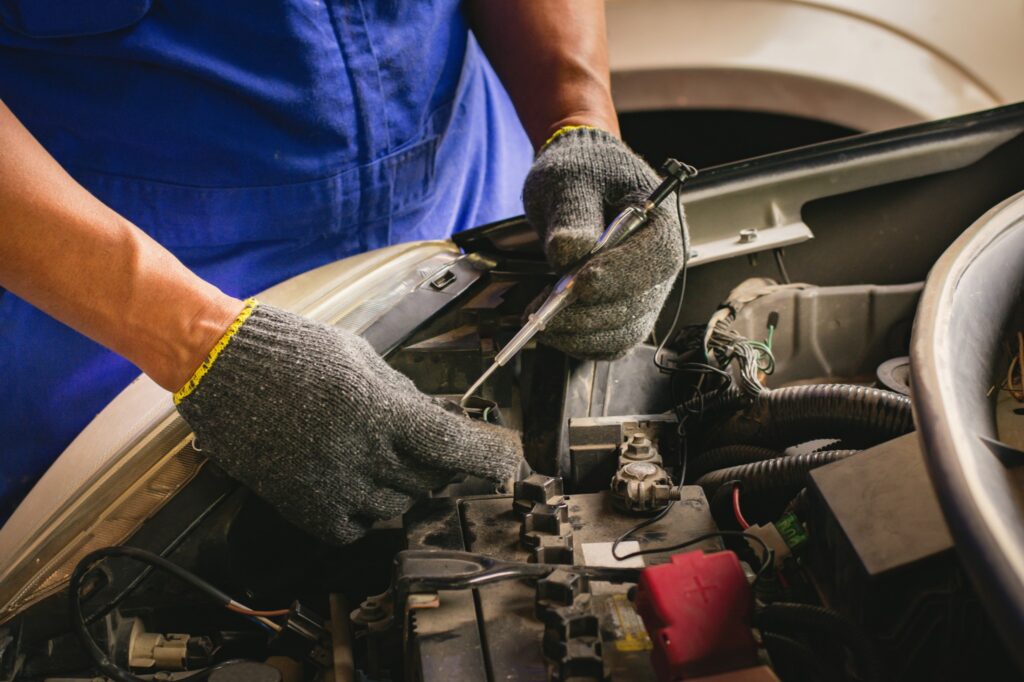 mechanic using automotive gloves