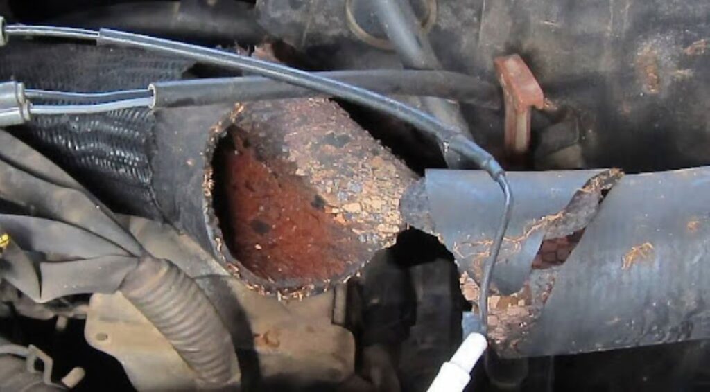 an image of a broken and engine coolant hose