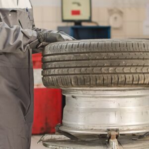 mechanic fixing a tire