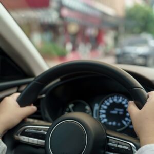 woman holding the steering wheel