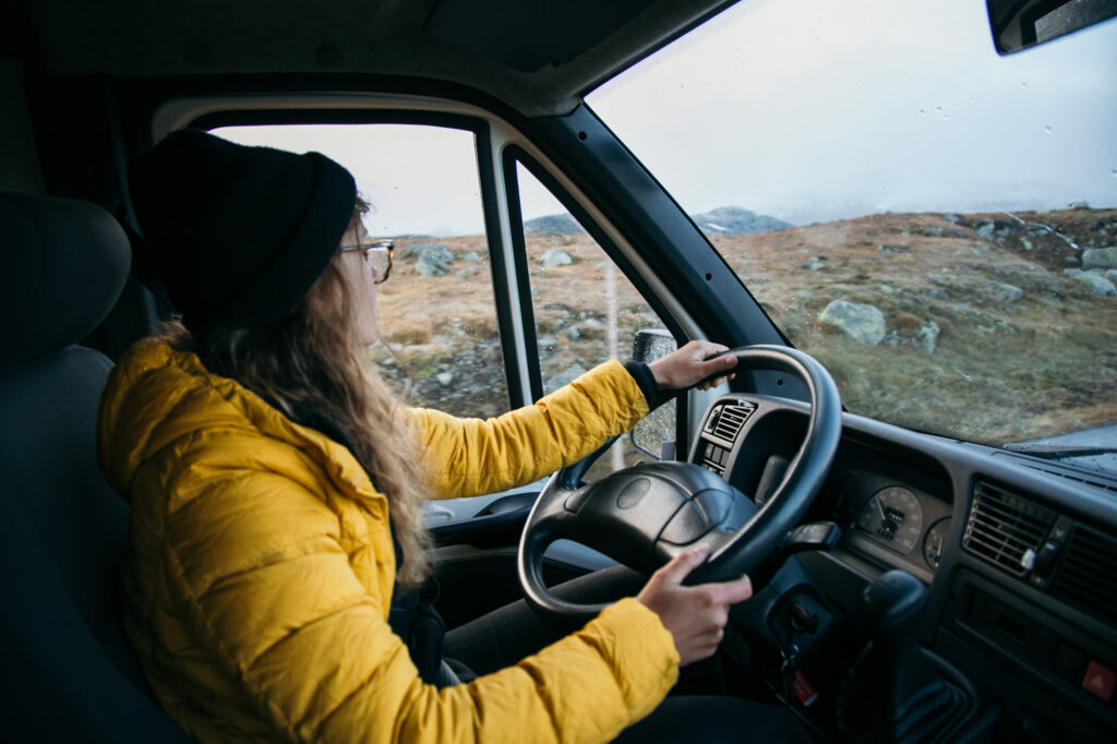 female driver driving a van