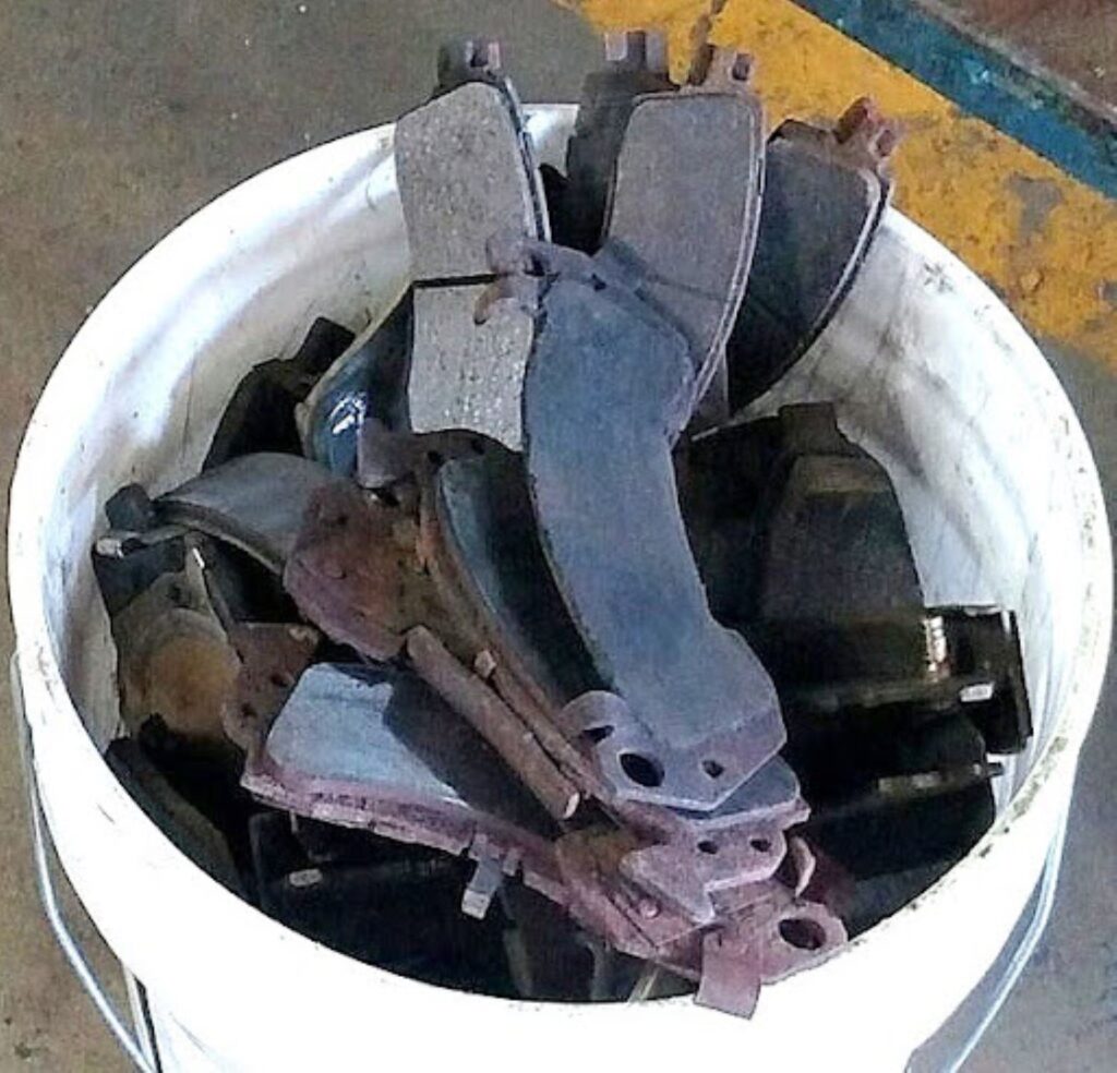 a pile of glazed brake pads