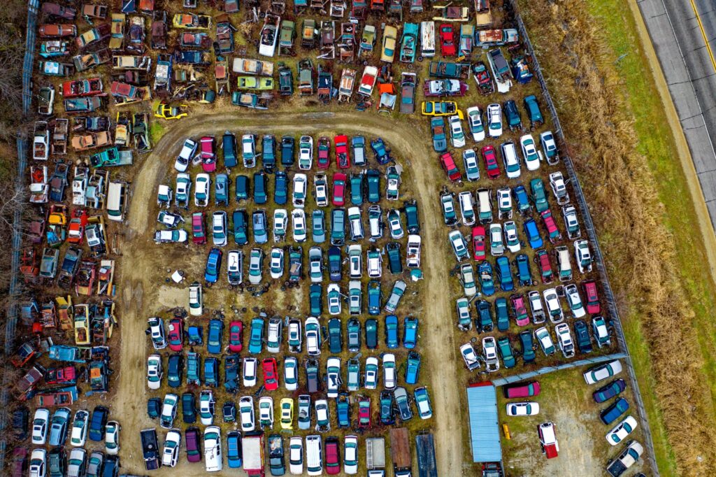 car junkyard filled with recycled cars