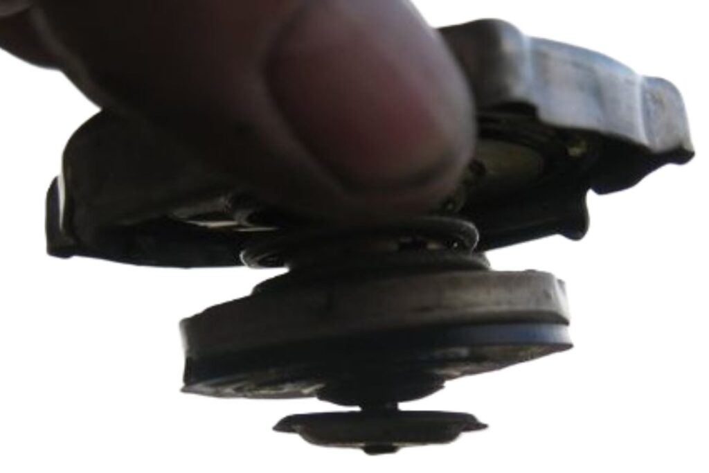 image of a radiator cap with spring loaded brass valve