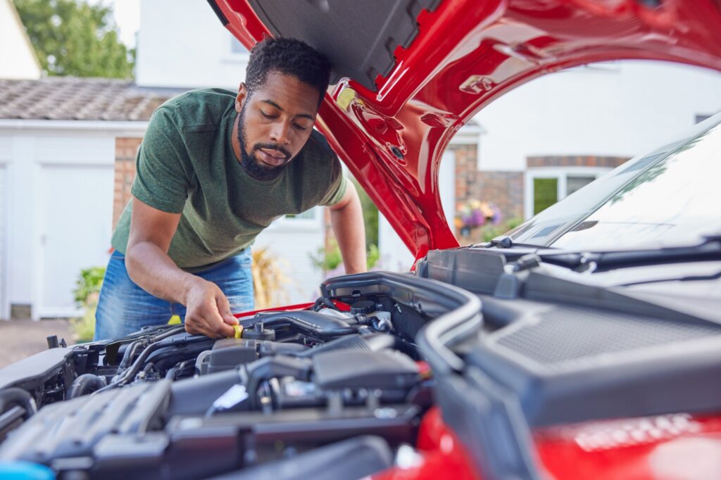 man addressing common car problem