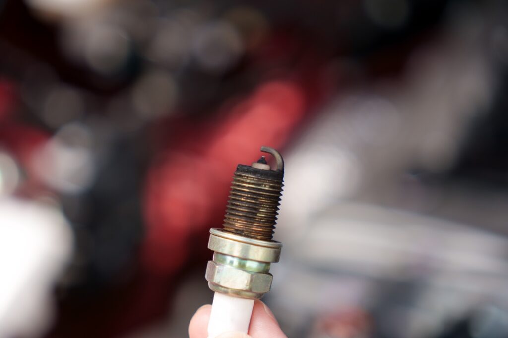 new spark plug turns black