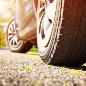 close up shot of car tires during summer