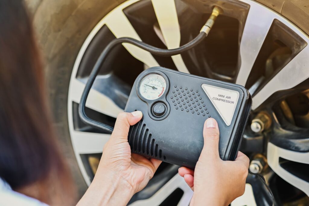 woman using a tire inflator