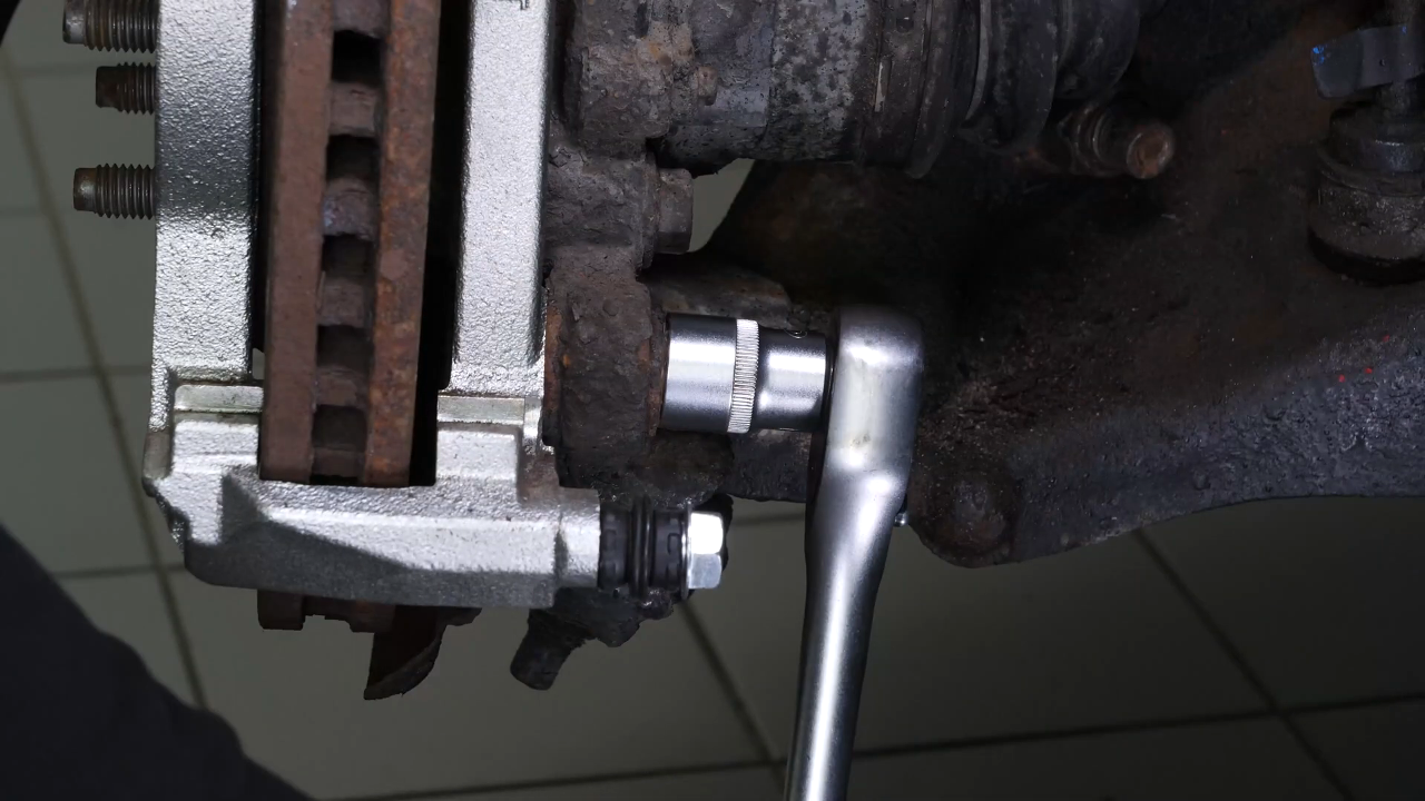 Remove the  brake caliper mount