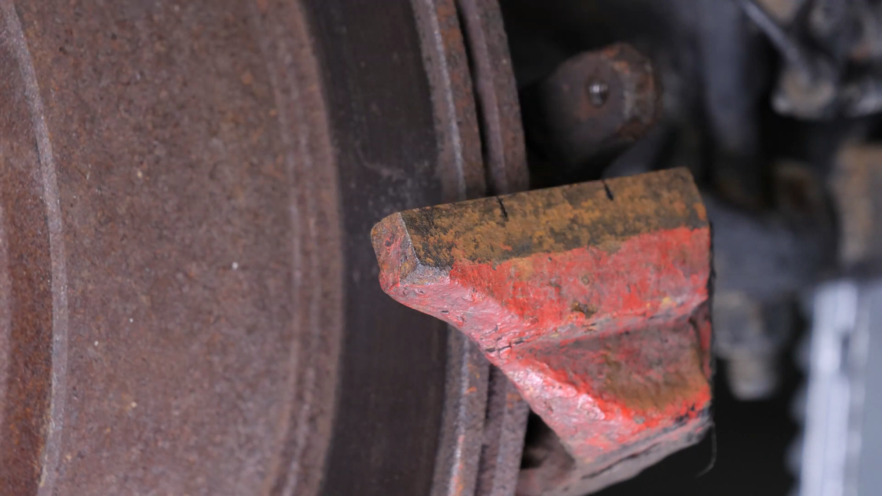 Clean the brake caliper mount