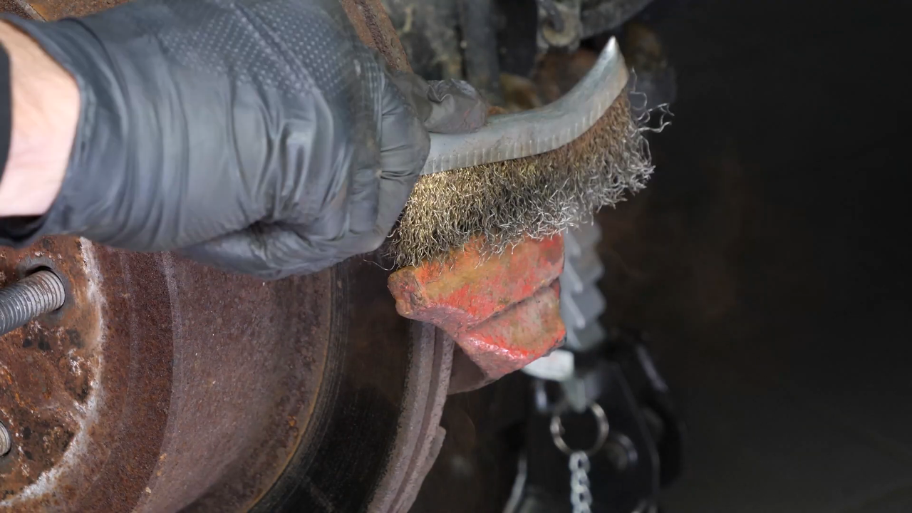 Clean the brake caliper mount