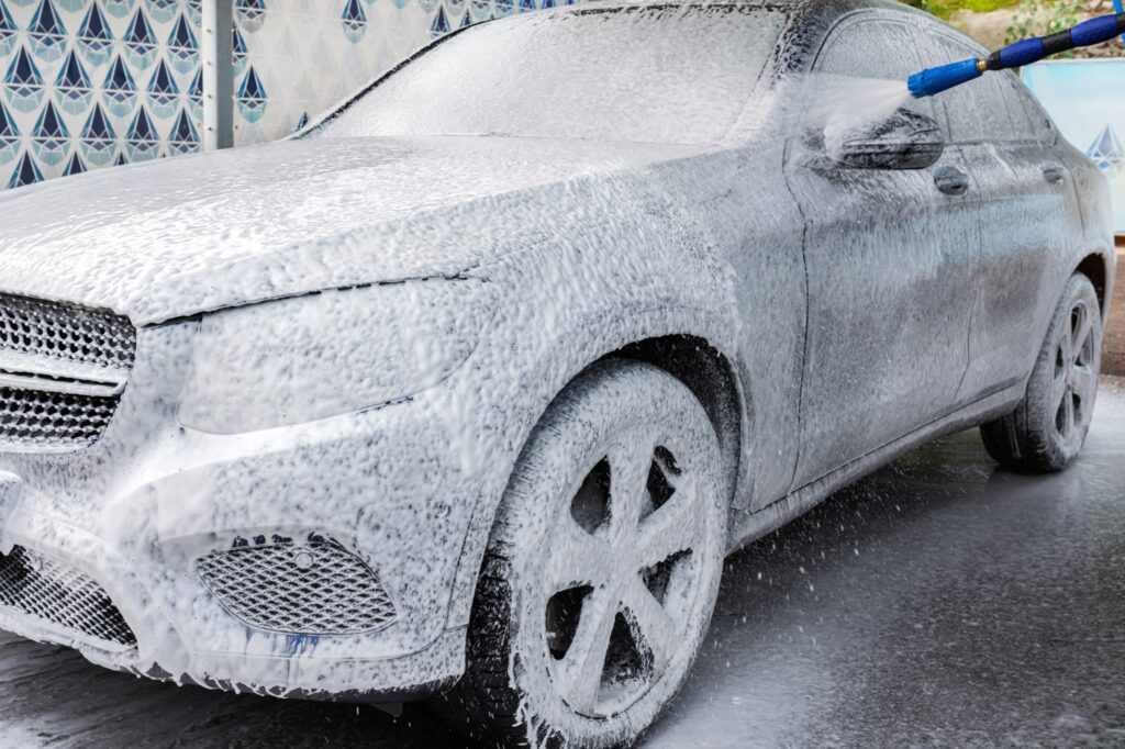 car covered in snow foam